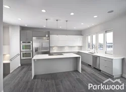 White kitchen with gray floor in the interior