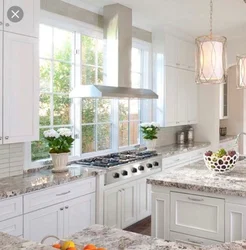 Gas stove by the window in the kitchen interior