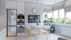 TV above the refrigerator in the kitchen photo