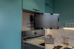 TV above the refrigerator in the kitchen photo