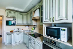 TV above the refrigerator in the kitchen photo