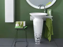Photo of a bathtub with a tulip sink