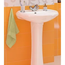 Photo of a bathtub with a tulip sink