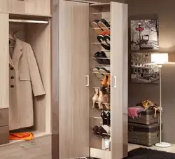 Shoe rack and mirror in the hallway in the interior