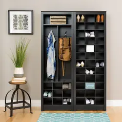 Shoe rack and mirror in the hallway in the interior