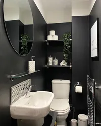 Black bathtub faucets in the interior photo