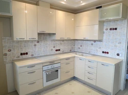 Cream-colored kitchen in the interior