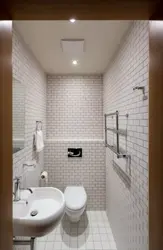 Toilet with washbasin in the apartment photo