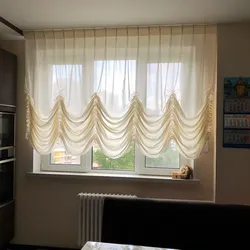 French curtains in the kitchen interior