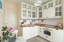Kitchen interior with white wood furniture