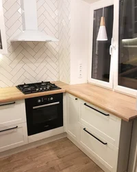 Kitchen design in Khrushchev with a window sill photo