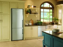 Free-standing refrigerator in the interior of the kitchen living room