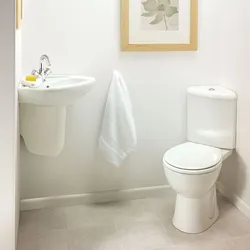 Bathroom with corner toilet photo