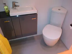 Bathroom with corner toilet photo