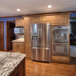Refrigerator in the middle of the kitchen photo
