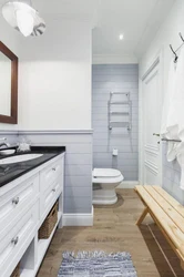 White bathroom design with wood