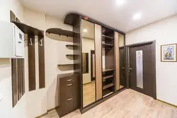 Photo of a hallway with a wardrobe in a modern style, narrow and long