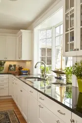 Photo of the kitchen in your house with a window photo