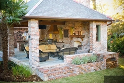 Summer kitchen design with barbecue area