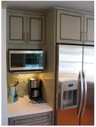 Kitchen interior with built-in microwave