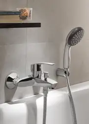 Photo Of A Faucet In A Bathroom With A Shower