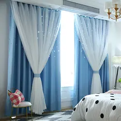 Blue curtains in the bedroom photo