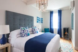 Blue curtains in the bedroom photo