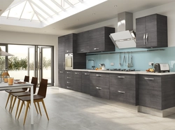 Gray kitchen with wooden facades photo