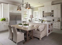 Kitchen design with a large table photo