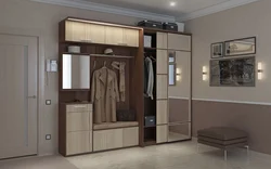 Sliding wardrobes in the hallway with a mirror and shoe rack design