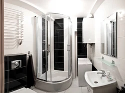 Photo of black and white bathtubs with showers