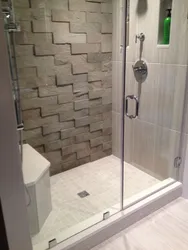 Bathroom with tile shower without tray design