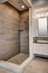 Bathroom with tile shower without tray design