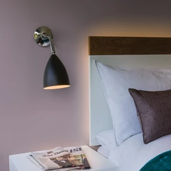 Lamp on the wall in the bedroom photo