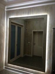 Mirror with lighting in the hallway design
