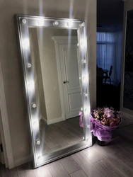 Mirror with lighting in the hallway design