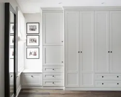 Wardrobe To The Ceiling With Hinged Doors In The Hallway Photo