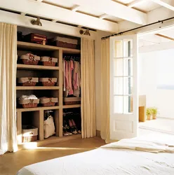 Dressing room with curtains instead of doors in the bedroom photo