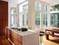 Kitchen design with panoramic windows in a modern style photo