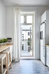 Modern window design with balcony in the kitchen