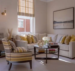 Different sofa and armchair in the living room interior