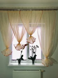 Hanging curtains in the kitchen photo