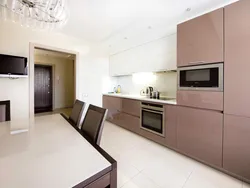 Beige kitchen design with black splashback