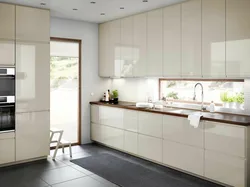 Beige kitchen design with black splashback