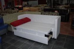 Photo of a small kitchen with a sleeping area