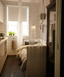 Photo of a small kitchen with a sleeping area