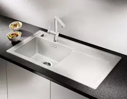 Dark kitchen sink photo