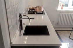 Dark kitchen sink photo