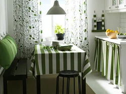 Wallpaper with leaves in the kitchen interior