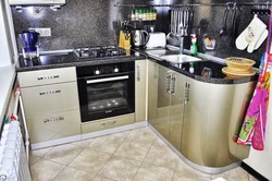 Corner kitchen design with refrigerator and dishwasher